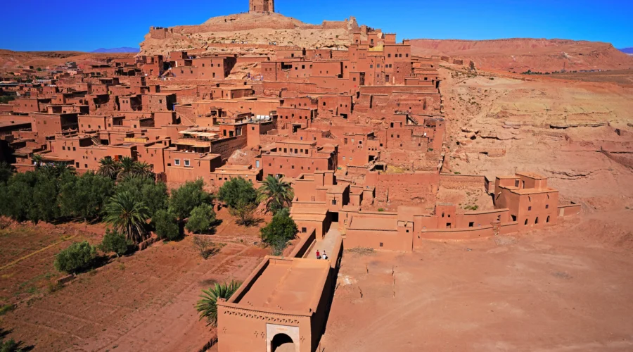 Ait Ben Haddou day trip view of the UNESCO fortified kasbah village and hilltop granary in Morocco