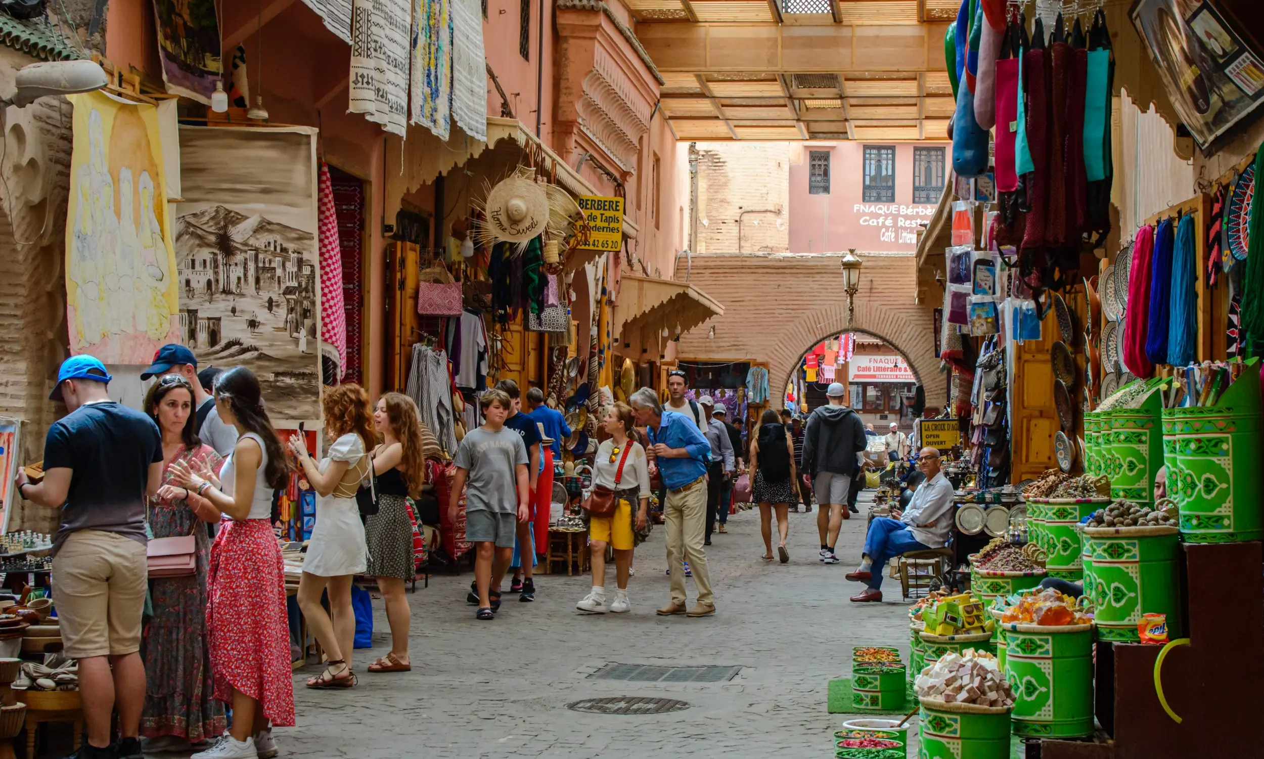 Morocco student holidays travelers exploring a busy souk market in Marrakech medina