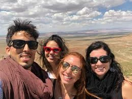 Can I travel from Australia to Morocco? Friends taking a group selfie overlooking the Moroccan countryside