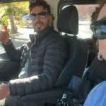 Friendly driver guide giving a thumbs up with a traveler during the 16 Days Morocco Tour From Casablanca