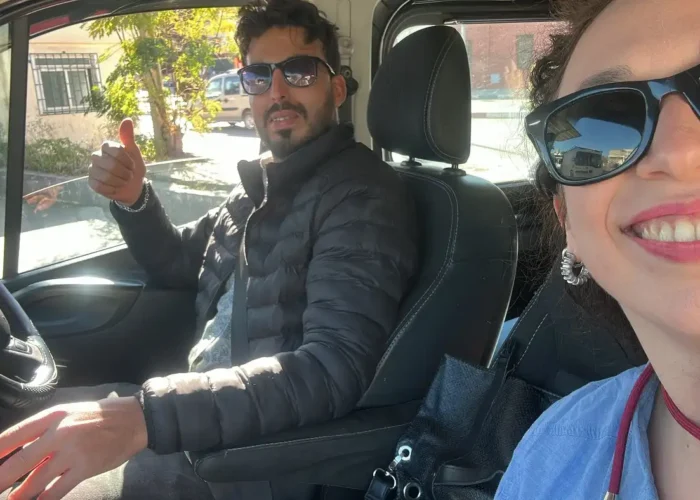 Friendly driver guide giving a thumbs up with a traveler during the 16 Days Morocco Tour From Casablanca