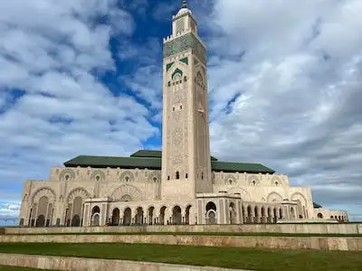 Casablanca Morocco Travel - Hassan II Mosque in Casablanca, Morocco, with its 210-meter minaret and green tiled roof.